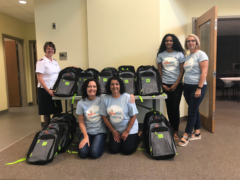 SEET Committee members posing with backpacks