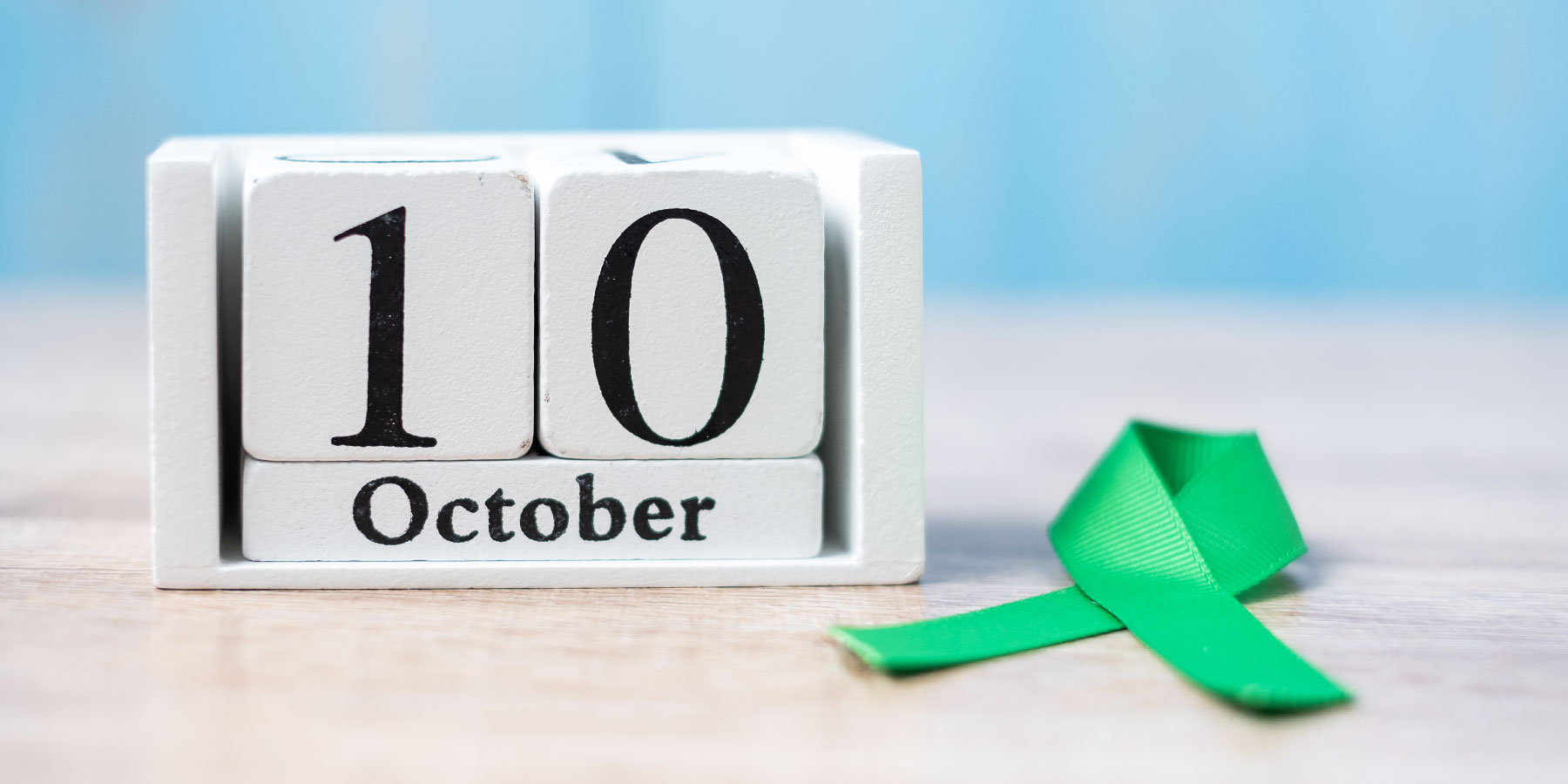 Alphabee World Health Day - Blocks spelling out October 10 with Green ribbon next to it