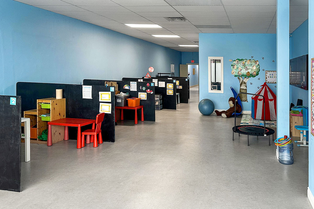 Therapy room at AlphaBee's Hamilton centre, with individual work stations and a sensory play corner